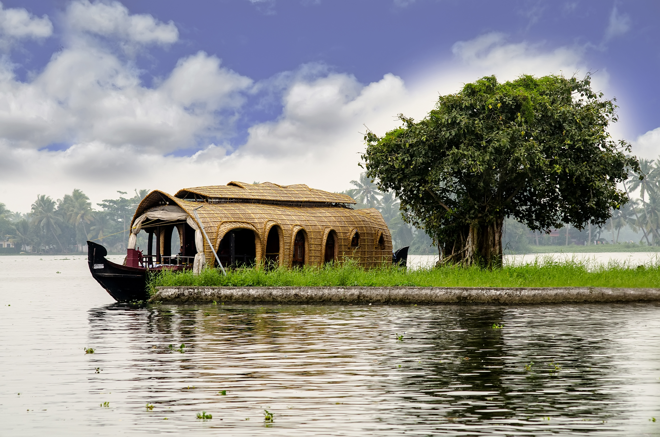 A traditional boat on the backwaters at Kumarakom, Kerala